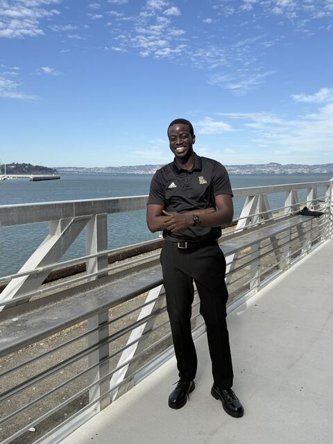Daniel smiling on the bay bridge walkway